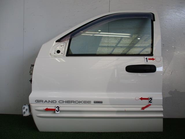 Front left Grand Cherokee door assembly with interior trim 